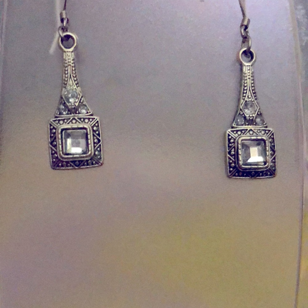 Silver dangly earrings.